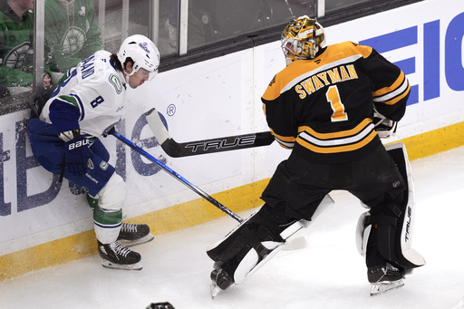 DeBrusk nets a goal in comeback to Boston while Canucks blank Bruins 2-0 with Lankinen’s strong performance