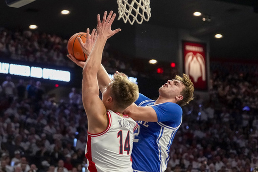 Cooper Flagg tallies 24 points, guiding No. 12 Duke to a 69-55 victory against No. 17 Arizona on the road.