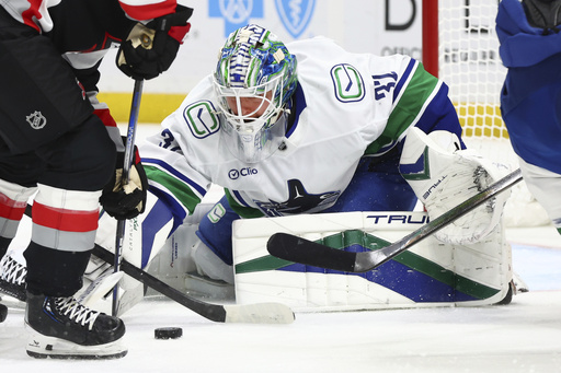 Conor Garland nets two goals, including the overtime winner, as Canucks comeback to defeat Sabres 4-3.