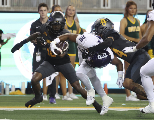 Bryson Washington records 4 touchdowns as Baylor narrowly defeats TCU 37-34 with a last-second field goal.