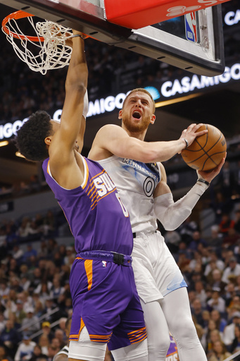 Randle nails buzzer-beating three-pointer, propelling Timberwolves to 120-117 victory against Booker and Suns.