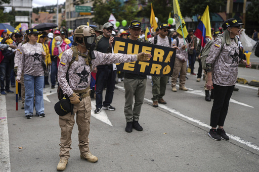 Tens of thousands of Colombians protest against suggested reforms and criticize the president.