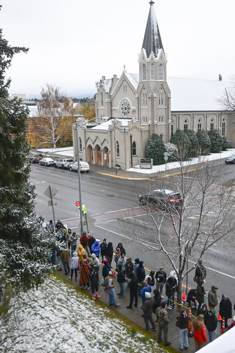 Montana voters brave the snow for hours while enjoying complimentary pizza and music from a DJ