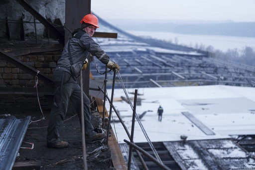 Ukrainian technicians perform maintenance amid ongoing Russian assaults on the national power infrastructure.