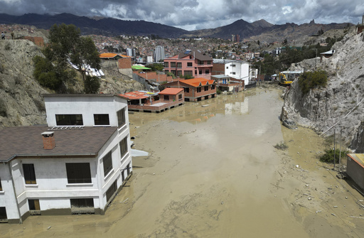 Intense rainfall in Bolivia causes mudslides in the capital, resulting in one person missing and homes being destroyed.