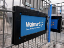 MIAMI, FLORIDA - NOVEMBER 18: A Walmart cart sits outside a Supercenter on November 18, 2024 in Miami, Florida. Walmart is set to report its third-quarter results on Tuesday, Nov. 19th. (Photo by Joe Raedle/Getty Images)