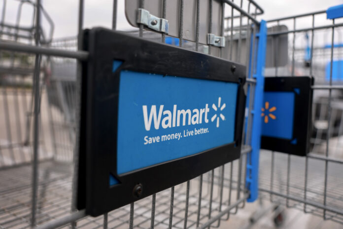 MIAMI, FLORIDA - NOVEMBER 18: A Walmart cart sits outside a Supercenter on November 18, 2024 in Miami, Florida. Walmart is set to report its third-quarter results on Tuesday, Nov. 19th. (Photo by Joe Raedle/Getty Images)