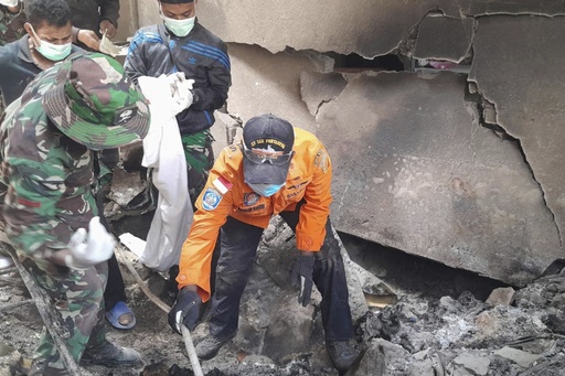 Rescue teams in Indonesia search through volcanic debris following an eruption that claimed 9 lives and damaged structures