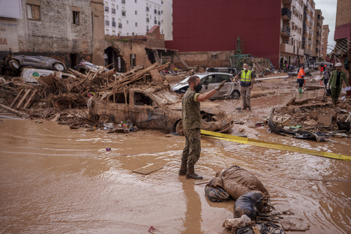 Barcelona’s rail services halted due to severe rainfall while rescue teams in Valencia seek additional flood victims.