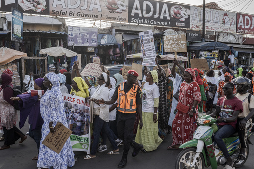 Senegalese women protest against polluting nations in a march for climate equity.