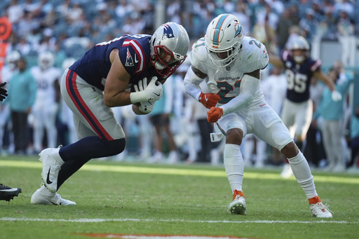 Tagovailoa shines with four touchdowns as Dolphins secure third consecutive victory, defeating Patriots 34-15.