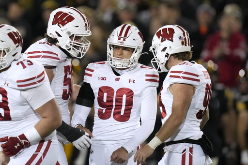 Top-ranked Oregon risks its perfect record in a matchup against Wisconsin.