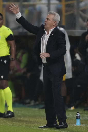 Mexico’s soccer coach Aguirre struck in the head by an object thrown from the crowd in Honduras