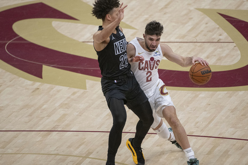 Evan Mobley tallies 23 points as Cavaliers overcome Nets 105-100, maintaining their flawless 11-0 record.