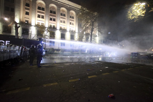 Over 100 detained as police confront demonstrators in Georgia amid halted EU negotiations.