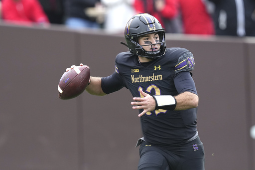 Howard leads No. 2 Ohio State to a decisive 31-7 victory over Northwestern at Wrigley Field