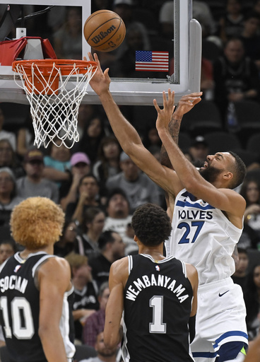 Johnson and Paul guide Spurs to 113-103 victory over Timberwolves while Popovich sits out due to illness