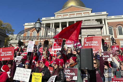 Massachusetts educators on strike reach out to governor outside the Statehouse