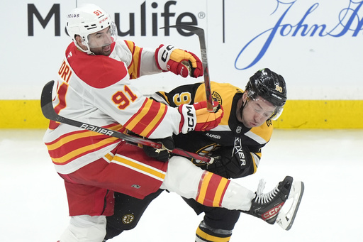 Brad Marchand nets overtime winner, propelling Bruins to 4-3 triumph against Flames