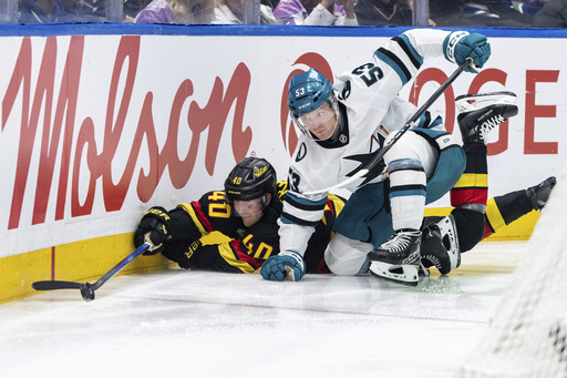 Pettersson nets two goals in 44 seconds, leading Canucks to a 4-3 victory over Sharks