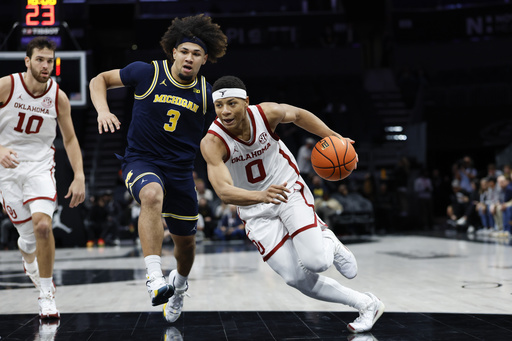 No Worries: Sooners’ guard stepped up as the second choice in decisive 4-point play that shocked No. 24 Michigan 87-86