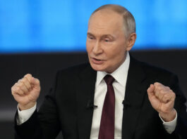 Russian President Vladimir Putin gestures while speaking during his annual news conference and call-in show at Gostinny Dvor in Moscow, Russia, Thursday, Dec. 19, 2024. (AP Photo/Alexander Zemlianichenko)