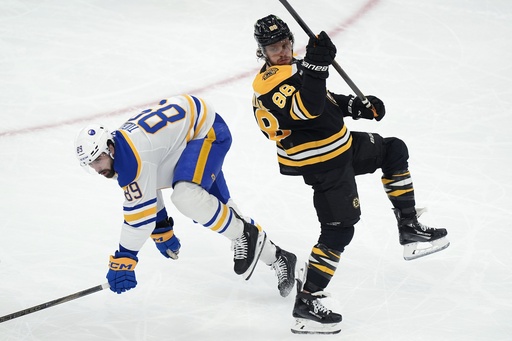 Top scorer David Pastrnak exits game due to upper-body injury