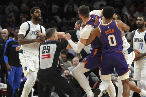 Jusuf Nurkic of Phoenix and Naji Marshall from Dallas involved in trade as three players are ejected following a confrontation.