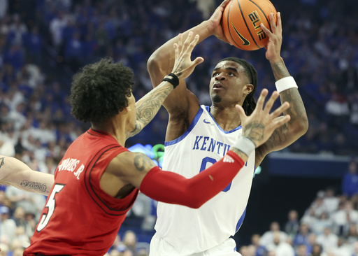 Lamont Butler sets personal best with 33 points, leading No. 5 Kentucky to a 93-85 victory over rival Louisville.