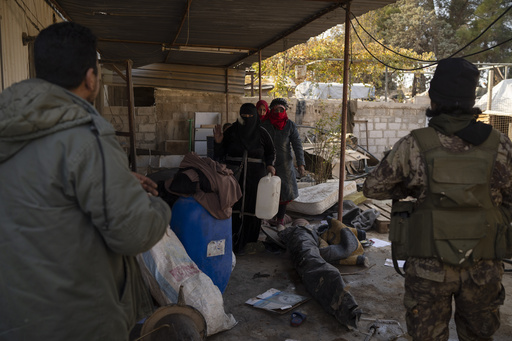 Syrian opposition troops move into a village close to Damascus to prevent theft.