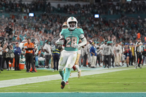 Dolphins secure playoff chances with 29-17 victory against 49ers, who were already out of contention prior to the match.