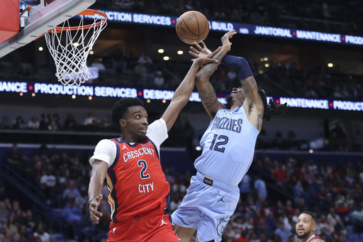 Morant injures shoulder, yet Jackson’s 33-point outing leads Grizzlies to 132-124 win over Pelicans