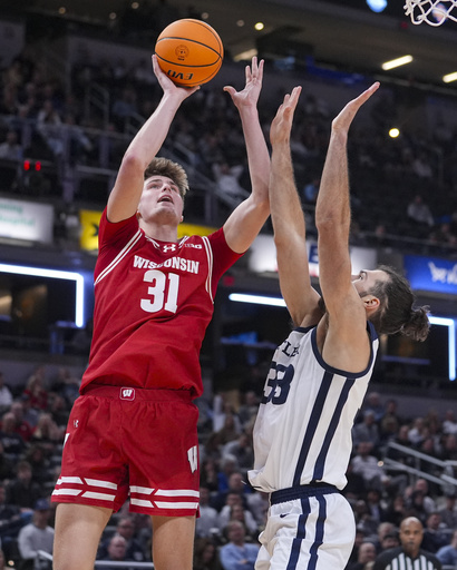 Nolan Winter achieves a career-best 20 points as No. 20 Wisconsin defeats Butler 83-74.