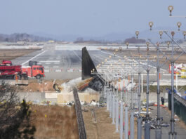 The wreckage of a Boeing 737-800 plane operated by South Korean budget airline Jeju Air lies at Muan International Airport in Muan, South Korea, Tuesday, Dec. 31, 2024. (AP Photo/Ahn Young-joon)