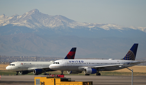 A second unauthorized traveler tries to sneak aboard a Delta flight during the holiday period.