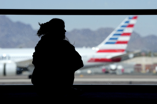 American Airlines reaches agreement in lawsuit with three Black men removed from a flight.