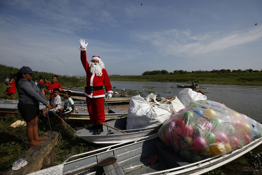 Santa tackles the sweltering heat of the Amazon rainforest to deliver presents to kids in a Brazilian community.