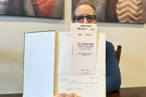 Chicago resident allowed to retain overdue baseball book from Detroit-area library after half a century.