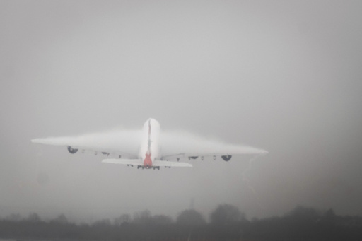 Dense fog causes flight delays during a peak travel weekend in the UK