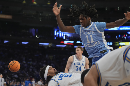 RJ Davis leads North Carolina to a 76-74 victory over No. 18 UCLA in CBS Sports Classic showdown.