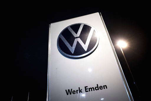 Volkswagen employees stage two-hour walkouts to protest suggested salary reductions and factory shutdowns