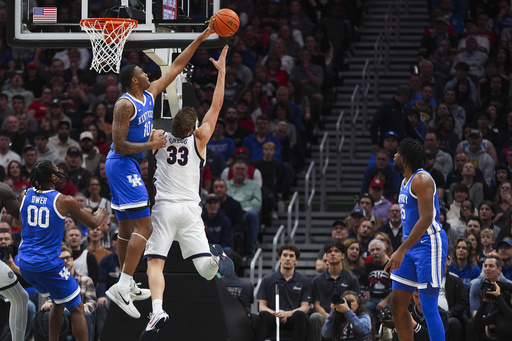 Kentucky, ranked fourth, rallies from 18 down to beat seventh-ranked Gonzaga in a thrilling 90-89 overtime victory.