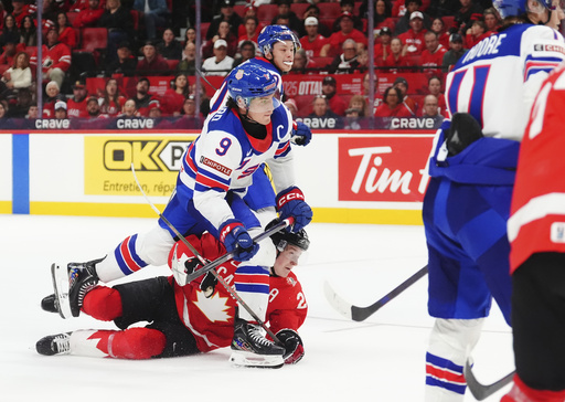 USA defeats Canada 4-1 to secure the top spot in their group at the junior world championship