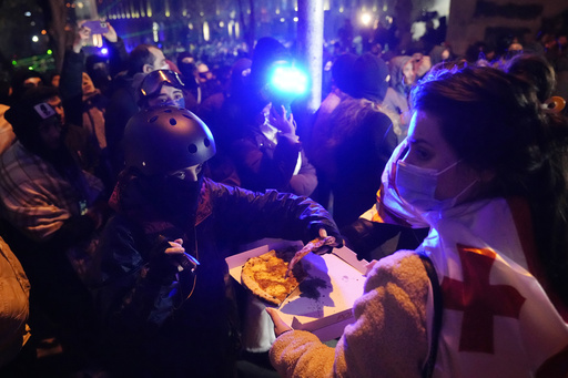 Georgia’s police intensify their harsh tactics as large-scale demonstrations against halting EU negotiations persist into the second week.