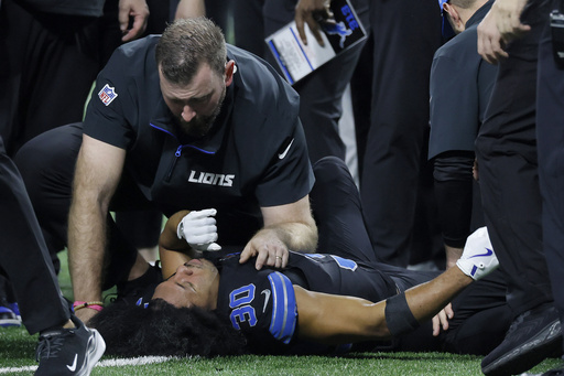 Lions defensive back Khalil Dorsey suffers leg injury after colliding with teammate during Bills game, taken off field on cart.