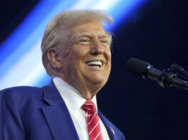 President-elect Donald Trump speaks at AmericaFest, Sunday, Dec. 22, 2024, in Phoenix. (AP Photo/Rick Scuteri)