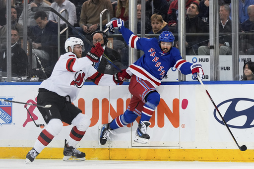 Jesper Bratt records a goal and three assists, while Jack Hughes nets two as Devils overpower struggling Rangers 5-1.