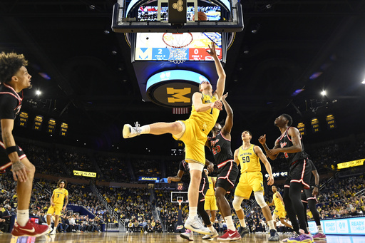 Michigan dominates Western Kentucky with a 112-64 win.