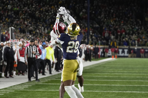 Notre Dame secures inaugural playoff victory at home, defeating Indiana 27-17 in new postseason format.