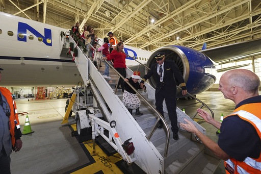 Children enjoy a flight to meet Santa at a North Pole-themed hangar at Denver airport.